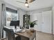 Cozy bedroom with ceiling fan, work desk, and storage shelving unit at 6523 S Field Way, Littleton, CO 80123