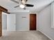 Bedroom with light-grey walls, carpet, closet, and ceiling fan at 6523 S Field Way, Littleton, CO 80123