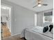 Bright bedroom with a ceiling fan and view from the window at 6523 S Field Way, Littleton, CO 80123