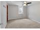 Neutral bedroom with ceiling fan, window, carpet and closet door at 6523 S Field Way, Littleton, CO 80123