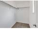 Walk-in closet with a hanging rod and neutral carpeting at 6523 S Field Way, Littleton, CO 80123