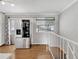 Modern kitchen featuring stainless steel appliances and lots of natural light, and hardwood floors at 6523 S Field Way, Littleton, CO 80123