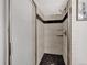 Tiled shower with glass door, tiled walls and black pebbled shower floor at 6523 S Field Way, Littleton, CO 80123