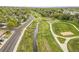 Picturesque aerial perspective of a park with paths, a bridge and creek meandering through at 5995 Estes St, Arvada, CO 80004
