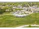 Scenic aerial view of a local park offering playgrounds, green spaces and walking paths at 5995 Estes St, Arvada, CO 80004