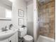 This bathroom features tiled walls and modern fixtures and hardware at 5995 Estes St, Arvada, CO 80004