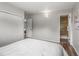 Bright bedroom features a closet and an en-suite bathroom with tiled shower at 5995 Estes St, Arvada, CO 80004
