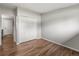 Bright bedroom with wood floors and a closet at 5995 Estes St, Arvada, CO 80004