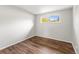 Bedroom with wood floors and natural light from the window at 5995 Estes St, Arvada, CO 80004