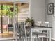 Dining room showcasing a table setting and view of the outdoor patio through sliding glass doors at 5995 Estes St, Arvada, CO 80004