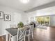 Dining room boasts stylish decor, modern furnishings, and lots of natural light at 5995 Estes St, Arvada, CO 80004