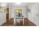 Bright dining room features a table setting and natural light from the sliding doors to backyard at 5995 Estes St, Arvada, CO 80004