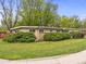 Inviting single-story home with verdant landscaping features a brick accent at 5995 Estes St, Arvada, CO 80004