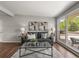 Bright living room featuring a comfortable sofa, stylish decor, and large windows at 5995 Estes St, Arvada, CO 80004