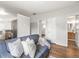 Open living room with sight lines to the kitchen, bathroom and additional rooms at 5995 Estes St, Arvada, CO 80004