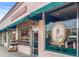 Charming storefront featuring Books & Gifts and La Dolce Vita Coffee House at 5995 Estes St, Arvada, CO 80004