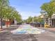 Vibrant street view showcasing a colorful floral mural and tree-lined sidewalks in Olde Town at 5995 Estes St, Arvada, CO 80004