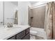 Stylish bathroom featuring a modern vanity with grey cabinets and a shower-tub combination with decorative tile at 17163 Desert Wine Trl, Parker, CO 80134