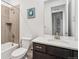 A bathroom features a shower-tub combo and a vanity with a sink at 17163 Desert Wine Trl, Parker, CO 80134