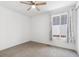 A bedroom features a ceiling fan, large windows and ample sunlight at 17163 Desert Wine Trl, Parker, CO 80134