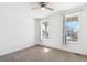 A bedroom features a ceiling fan and large windows at 17163 Desert Wine Trl, Parker, CO 80134
