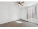 A bedroom features a ceiling fan and large window at 17163 Desert Wine Trl, Parker, CO 80134