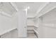 A walk-in closet features built-in shelving and plenty of room for storage at 17163 Desert Wine Trl, Parker, CO 80134