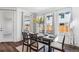 Bright dining area with large windows and modern table setting at 17163 Desert Wine Trl, Parker, CO 80134