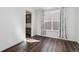 An empty living room space filled with natural light and wood flooring at 17163 Desert Wine Trl, Parker, CO 80134