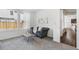 A cozy living room features a comfortable sofa, a side table and large windows at 17163 Desert Wine Trl, Parker, CO 80134