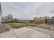Large, fenced backyard with a view of the surrounding landscape and community at 6102 S Owens Ct, Littleton, CO 80127