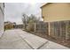 Concrete patio and walkway featured in a private backyard with a wooden fence at 6102 S Owens Ct, Littleton, CO 80127