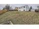 Expansive backyard offering ample space, surrounded by houses and wooden fencing at 6102 S Owens Ct, Littleton, CO 80127