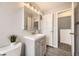 A tidy bathroom with a gray vanity, modern mirror, and neutral walls offers a fresh look at 6102 S Owens Ct, Littleton, CO 80127