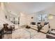Inviting living room showcasing stairs, sleek furnishings, and ample natural light at 6102 S Owens Ct, Littleton, CO 80127