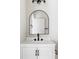 Modern bathroom features a white vanity, matte black fixtures, and contemporary mirror at 1566 S Richfield Way, Aurora, CO 80017