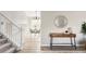 Hallway with decorative table and mirror, leading into the dining room at 1566 S Richfield Way, Aurora, CO 80017