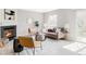 Bright living room features a fireplace, neutral color palette, and large window for natural light at 1566 S Richfield Way, Aurora, CO 80017