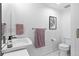 Well-lit bathroom with a modern sink, toilet, and stylish fixtures at 1930 Hooker St # 3, Denver, CO 80204