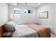 Bright bedroom featuring a comfortable bed and natural light from large windows at 1930 Hooker St # 3, Denver, CO 80204