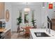 Cozy dining area featuring a round table, chairs, and decorative plants near the windows at 1930 Hooker St # 3, Denver, CO 80204