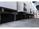 Modern townhome exterior with black garage doors and architectural details at 1930 Hooker St # 3, Denver, CO 80204