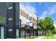 Contemporary townhomes showcase stylish exteriors with private balconies and well-maintained landscaping at 1930 Hooker St # 3, Denver, CO 80204