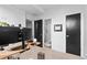 Functional home office with a desk, comfortable chair, and a well-lit workspace at 1930 Hooker St # 3, Denver, CO 80204