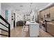 Modern kitchen with stainless steel appliances, white countertops, hardwood flooring, and pendant lighting at 1930 Hooker St # 3, Denver, CO 80204