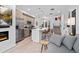 Open concept living and kitchen area with stainless steel appliances, and hardwood floors throughout at 1930 Hooker St # 3, Denver, CO 80204