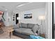 Cozy living room features a comfortable gray sofa, stylish lighting, and a modern mountain landscape artwork at 1930 Hooker St # 3, Denver, CO 80204