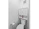 Clean powder room featuring a toilet with overhead storage and a modern design at 1930 Hooker St # 3, Denver, CO 80204