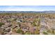 Aerial view of a neighborhood featuring mature trees, diverse housing styles, and mountain views at 3540 Vrain St, Denver, CO 80212