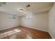 Finished basement with hardwood floors, neutral walls, and natural light from two windows at 3540 Vrain St, Denver, CO 80212